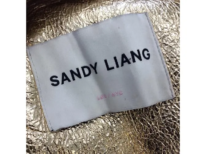 Autre Marque Chaqueta motera con cremallera y borreguito de cordero metalizado dorado de Sandy Liang 